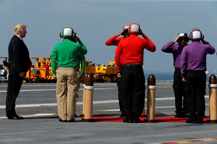 President Donald Trump arrives aboard the deck of the aircraft carrier USS Gerald R. Ford for its commissioning ceremony at N