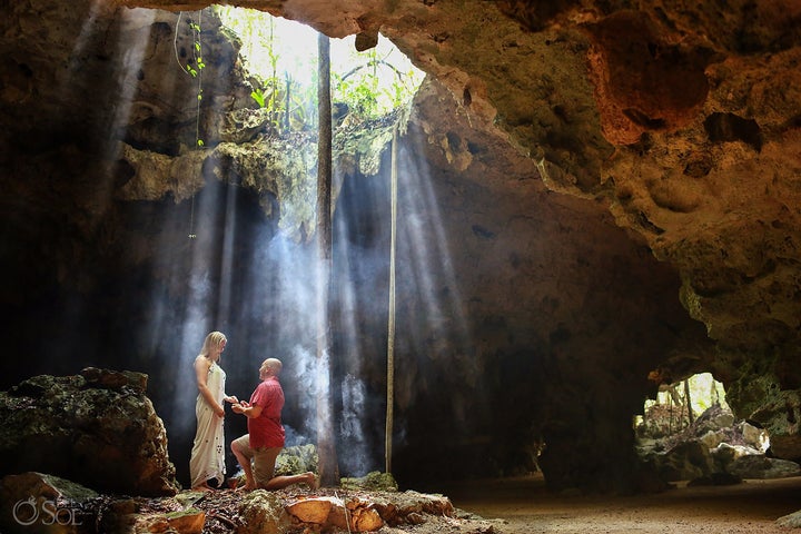 The cave was a stunning backdrop for the proposal. 