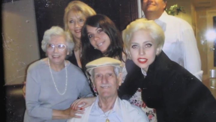Lady Gaga poses with family members gathered around her grandfather.
