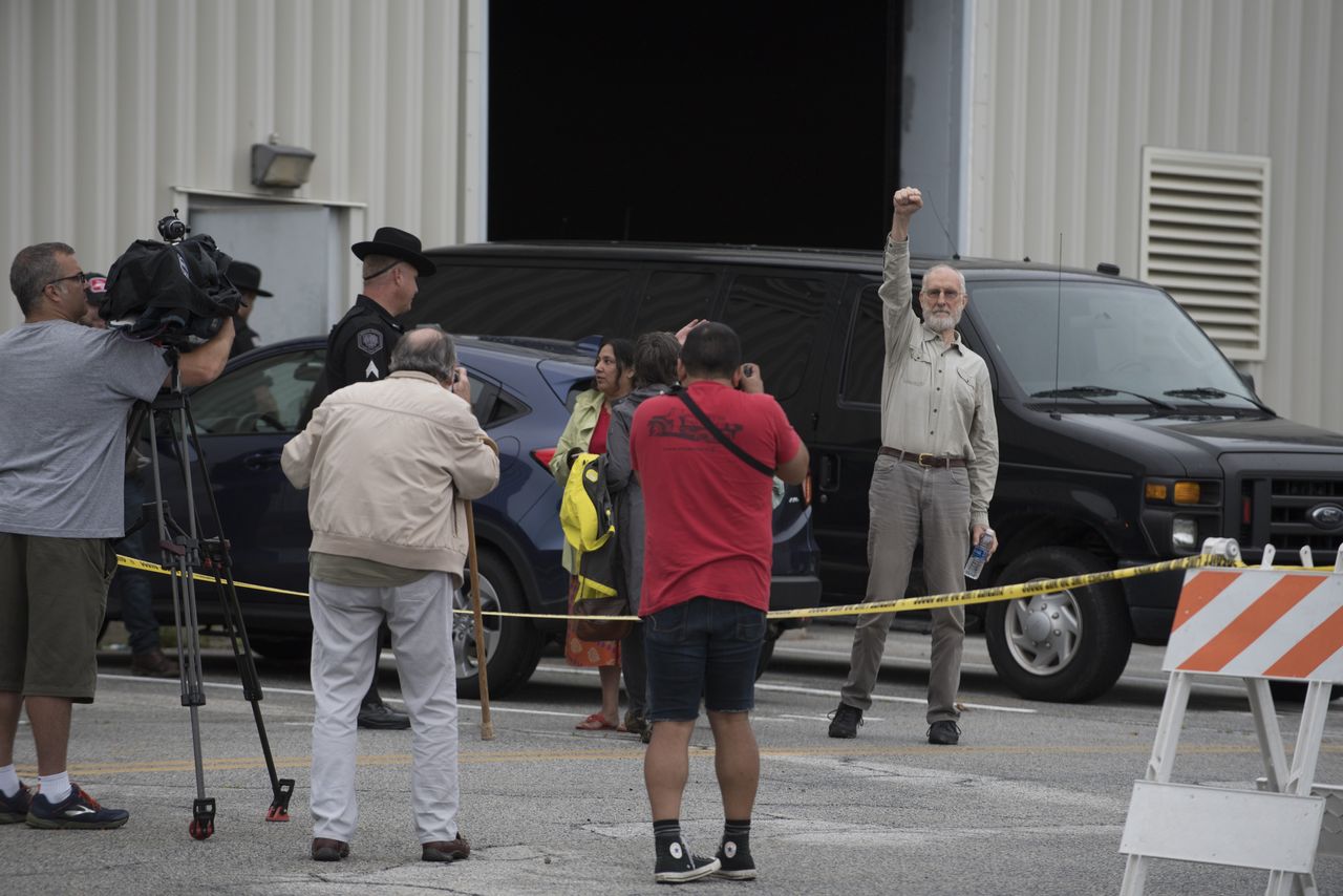 James Cromwell raises a fist outside the Orange County jail after turning himself in for his part in a protest outside the CPV Power Plant site in Wawayanda, New York.