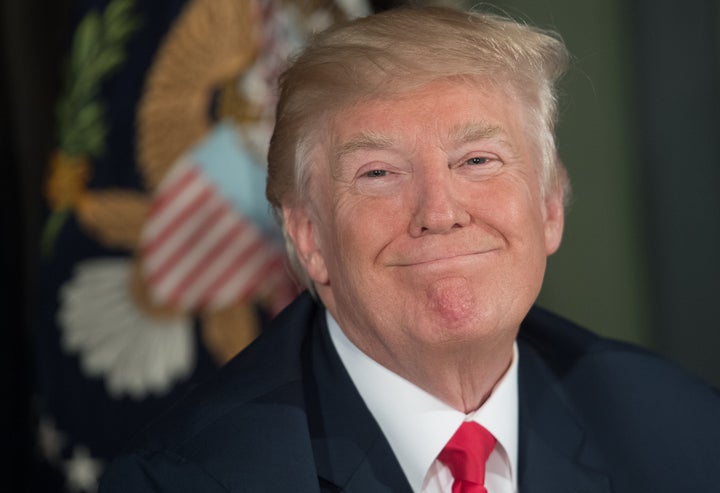 President Donald Trump looks on before a meeting with administration officials on the opioid addiction crisis at the Trump Na