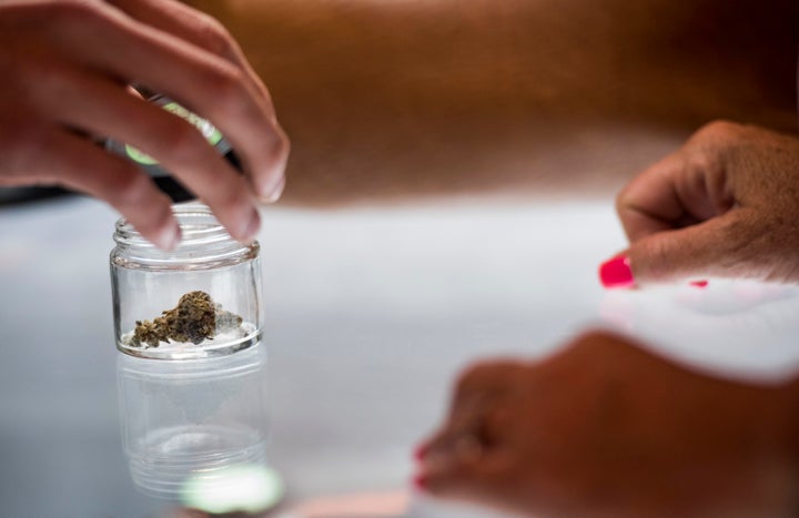 A budtender shows a patient a certain type of cannibis at the Blum Medical Marijuana Dispensary just a week after Nevada lega