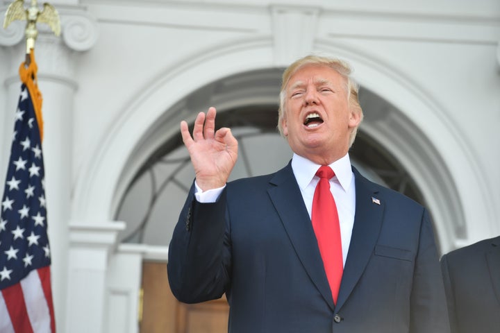 President Donald Trump speaks to the press at his golf club in Bedminster, New Jersey, on Thursday.