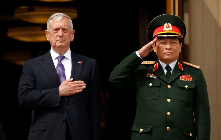 US Defence Secretary Jim Mattis (L) and Vietnamese Defense Minister Gen. Ngo Xuan Lich listen to national anthems during an honor cordon at the Pentagon in Arlington, Virginia, US, August 8.