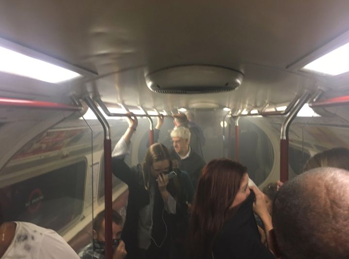 Commuters on a smoke-filled carriage 