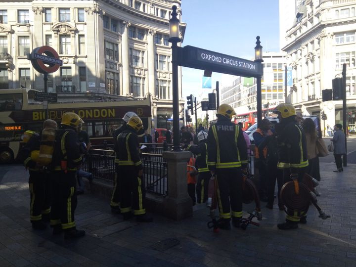 Fire-fighters entering the tube station this morning 