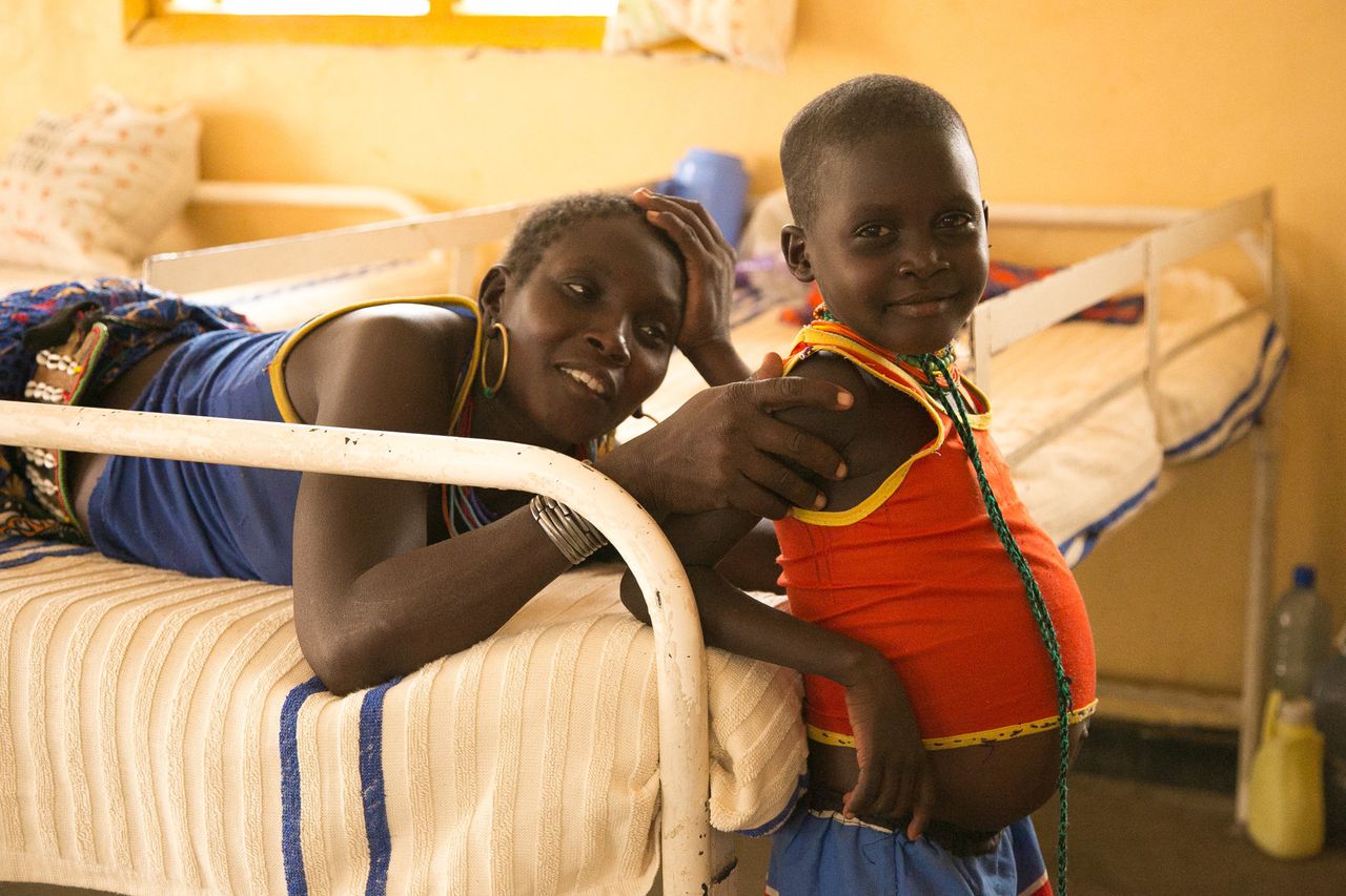 A mother sits with her child, who is being treated for kala azar in the specialty ward at Kacheliba Hospital in western Kenya.