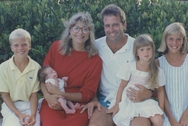 The King family in 1988. Michael King, center, didn't want his two sons to play football.<br>