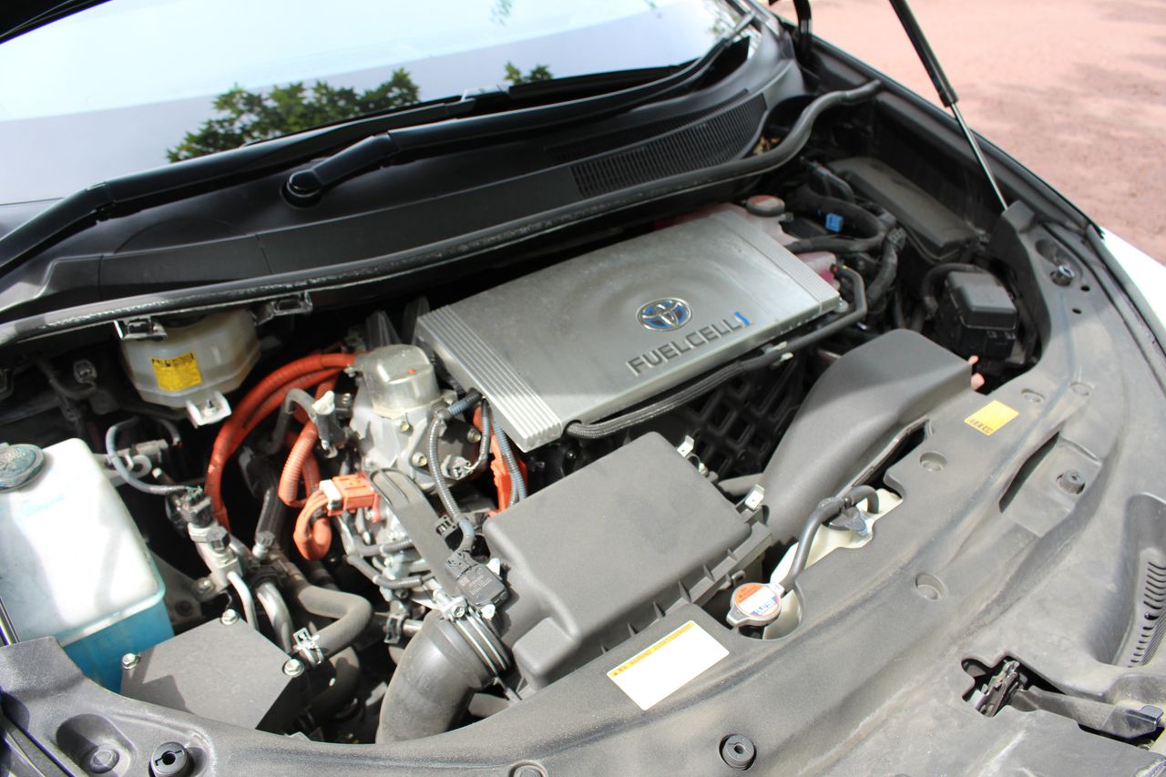 Inside the Mirai's hood, with the fuel cell pictured centre