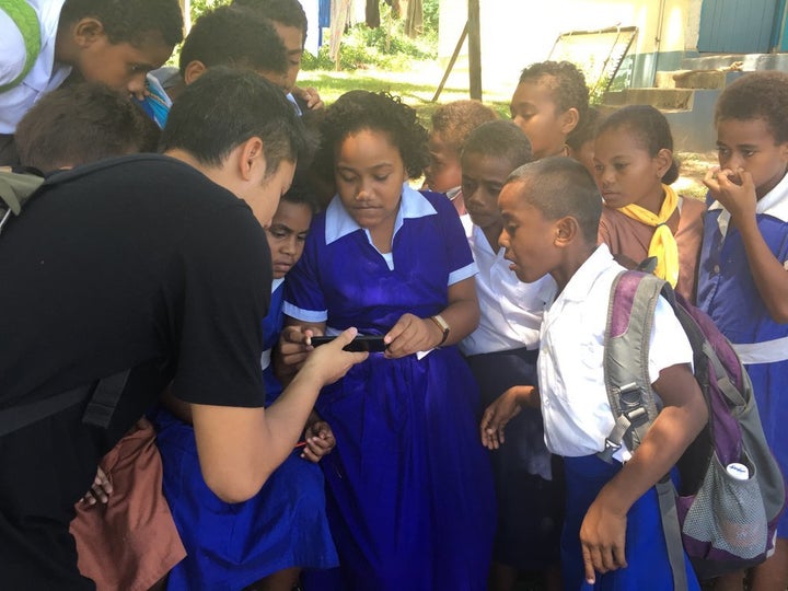 Producer Tash Tan of S1T2 sharing an AR demo to students as part of a LAUNCH Legends research trip to Fiji.