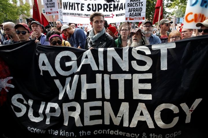 A group of counter-protesters rally against white supremacists in Charlottesville, Virginia on Saturday, Aug. 12, 2017.