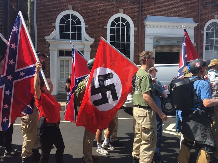 Nazi and Confederate flags are carried at the "Unite the Right" protest in Charlottesville, Virginia.