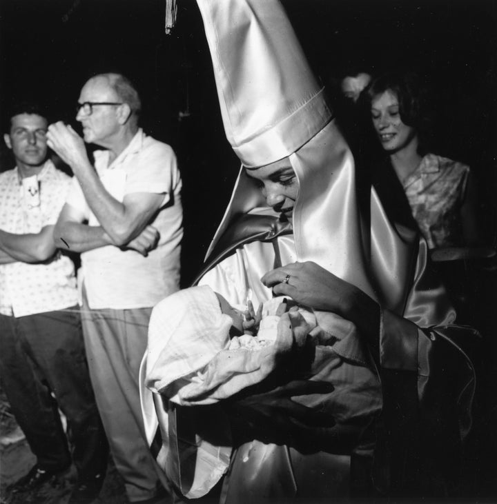 A woman member of the KKK takes her baby to a Klan meeting in South Carolina in 1965.