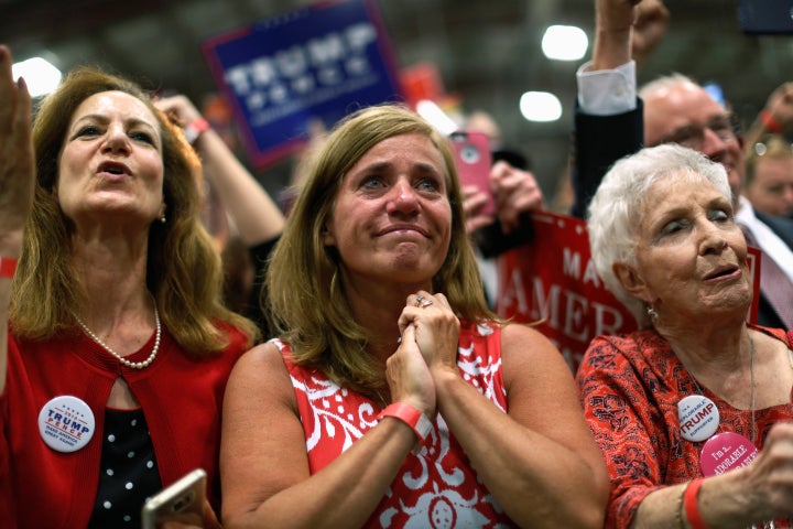 Three women attend a Donald Trump rally in Newtown, Pennsylvania, in October 2016.