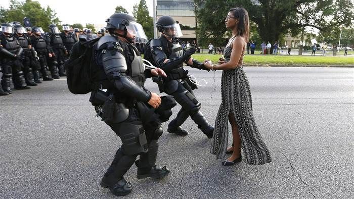 Black Lives Matter activist, Ieshia Evans, remaining calm while walking up to a line of riot police Baton Rouge, Louisiana. 