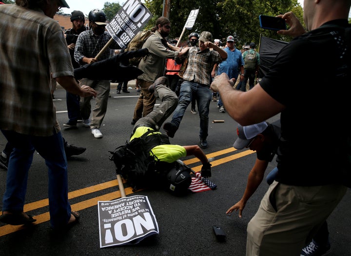 A white supremacist fights with counter-protesters in Charlottesville, Virginia, on Saturday.