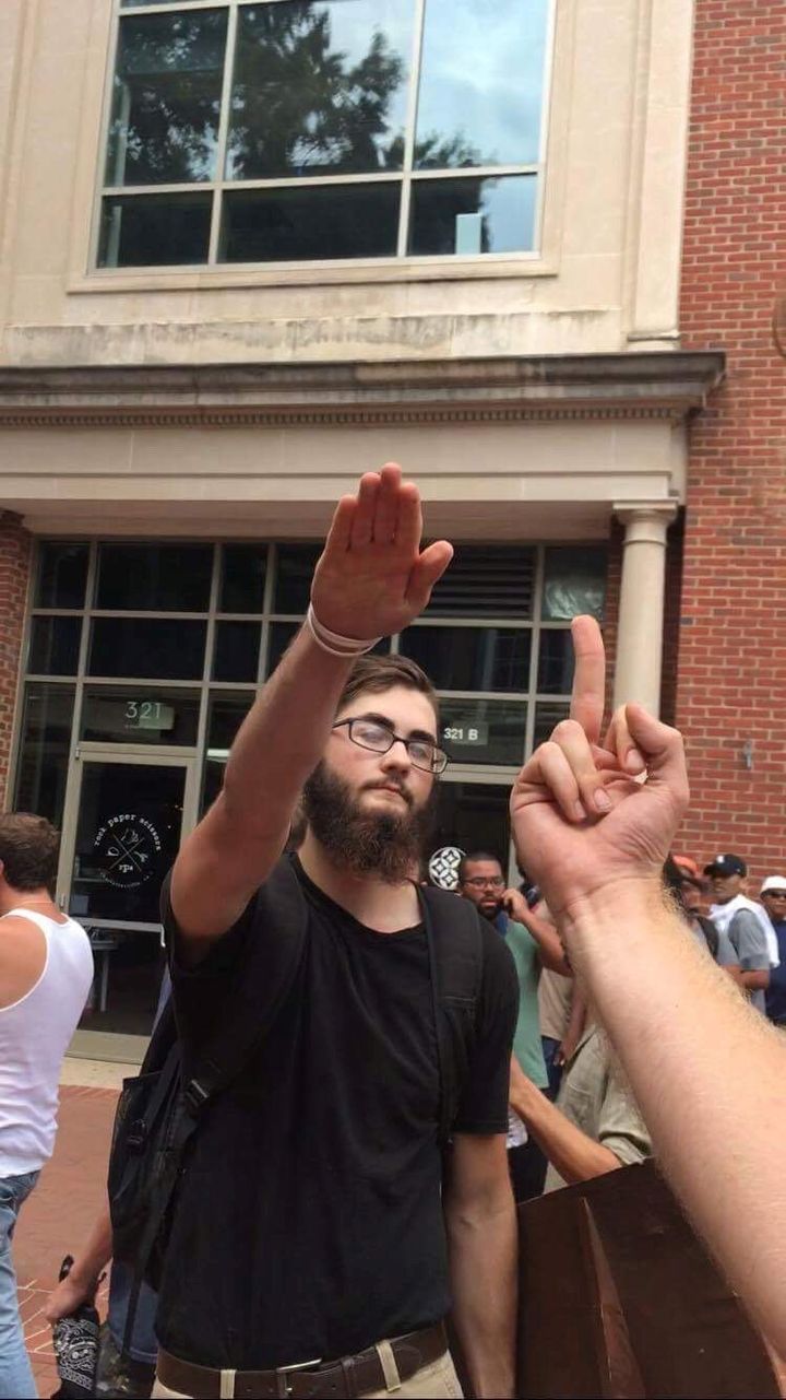 A white supremacist protester gives a Nazi salute at the 'Unite The Right' rally