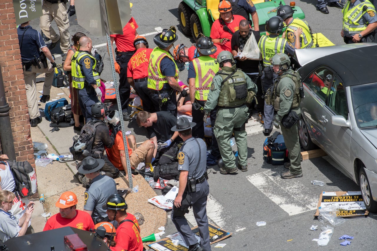 People receive first aid after a car drove into a crowd of protesters in Charlottesville, Virginia.