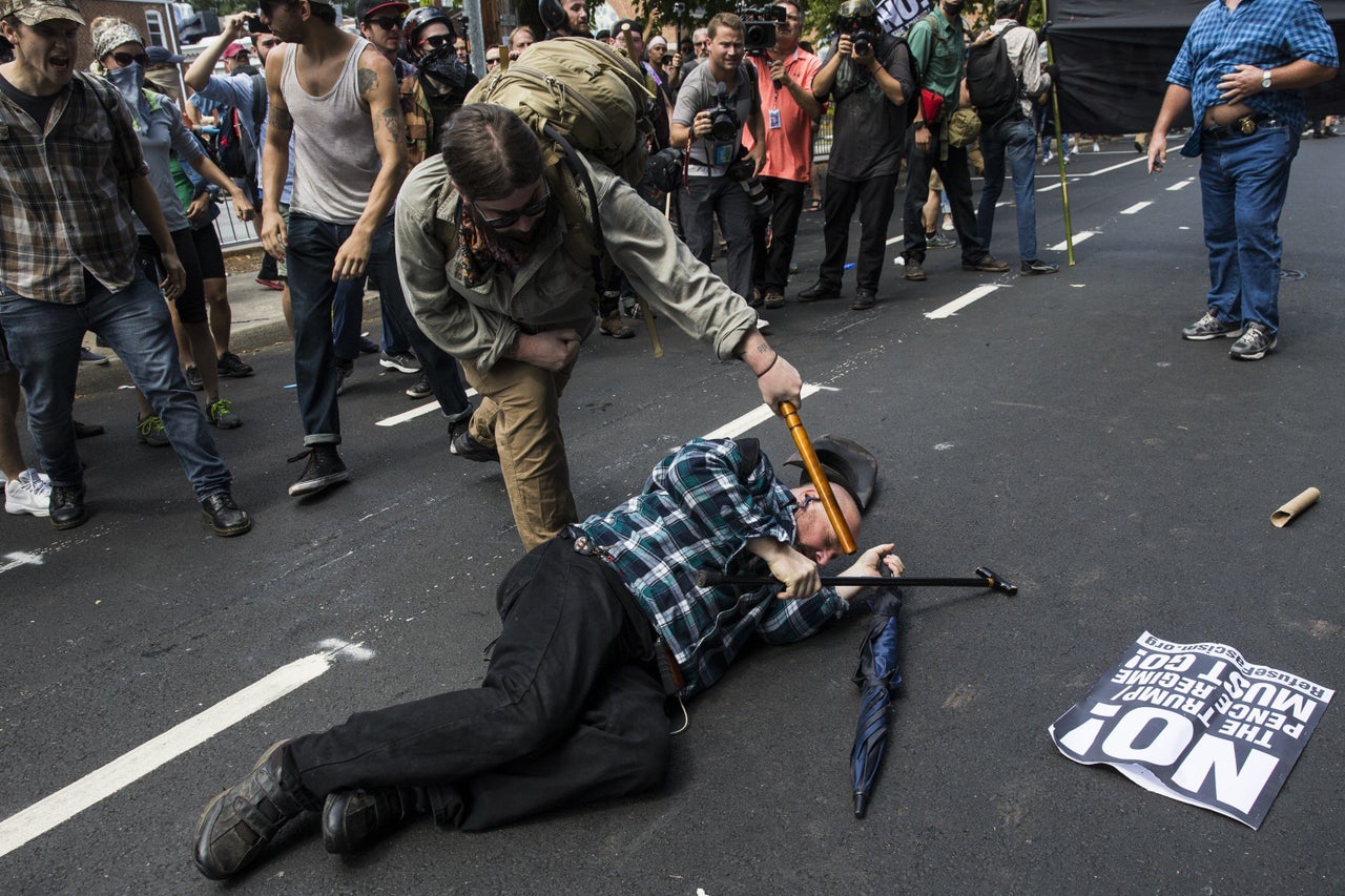 A counter-protester strikes a white nationalist with a baton during clashes at Emancipation Park where the "alt-right" was protesting the removal of the Robert E. Lee monument in Charlottesville, Virginia.