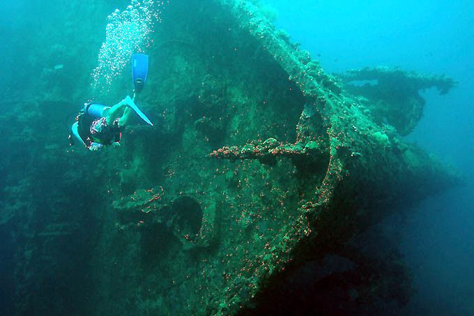 Diver explores a WWII wreck off Guadalcanal