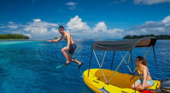 <p>Visitor enjoying the warm waters of the Solomon Islands</p>