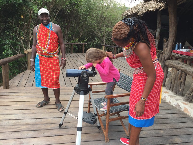 Our daughter gets a closer look at the animals from the observation deck at Tangulia Mara Camp, Kenya