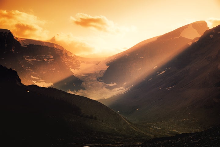 <p>As the day draws to a close, the light pours onto the face of Snow Dome. Viewable from Icefield Center. </p>