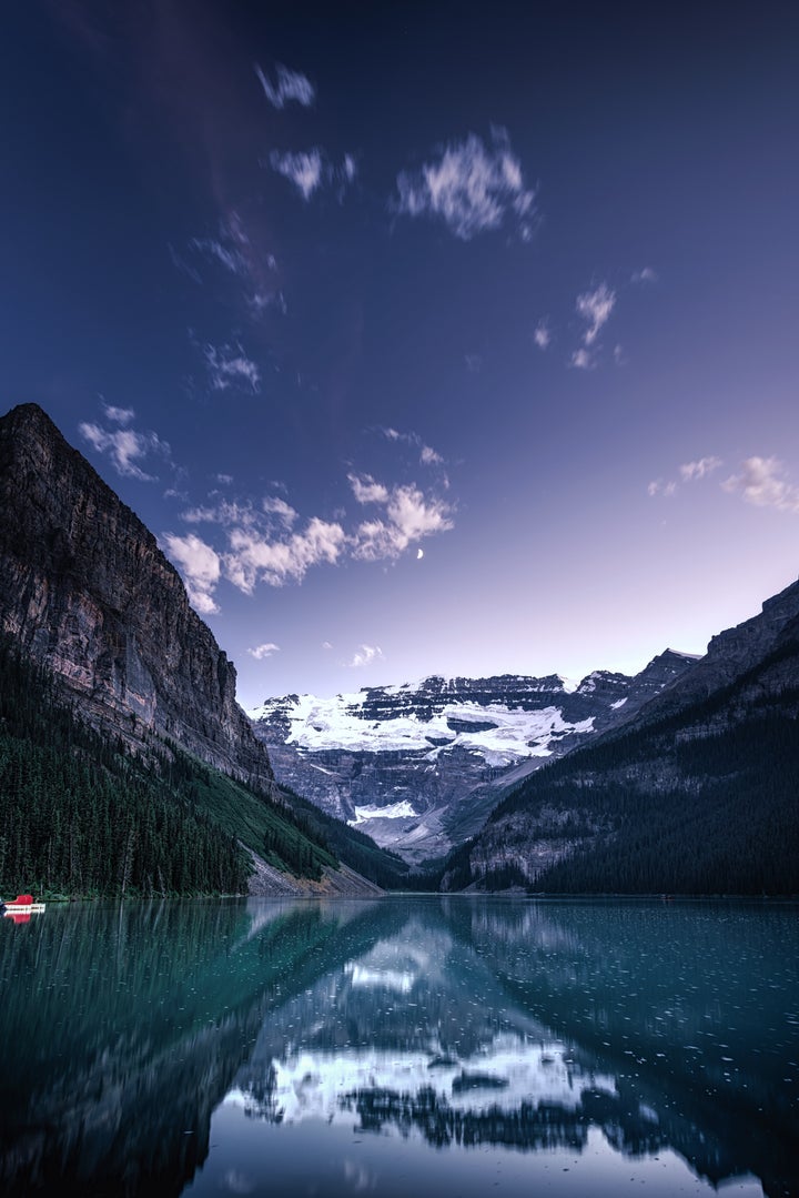 <p>Blue Hour at Lake Louise. It’s also quiet late in the Summer evenings, so if you’re not a morning person and still want to miss the crowds, try arriving at sunset and staying until dark. </p>