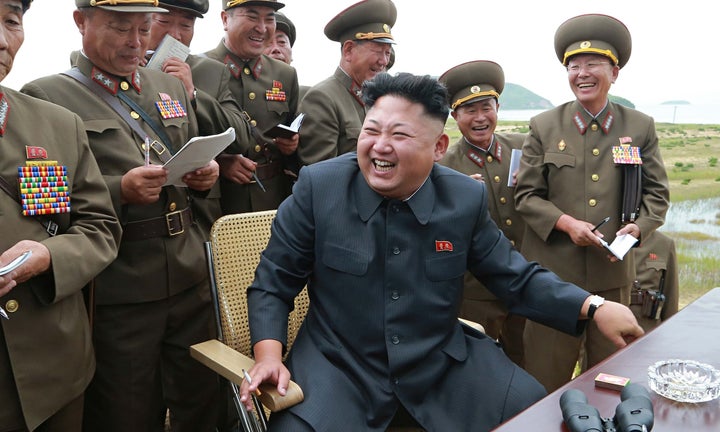 33 year old Supreme Leader, Kim Jong-Un among his generals