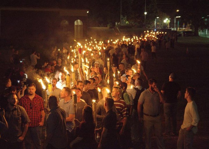 White nationalists carry torches on the grounds of the University of Virginia, on the eve of a planned Unite The Right rally in Charlottesville, Virginia 