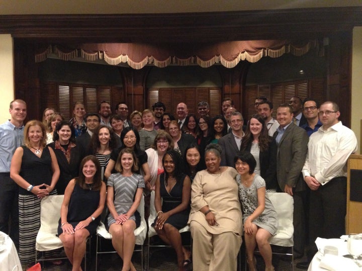 Dr. Jonathan Doll is on the right in the third row wearing a royal blue shirt.