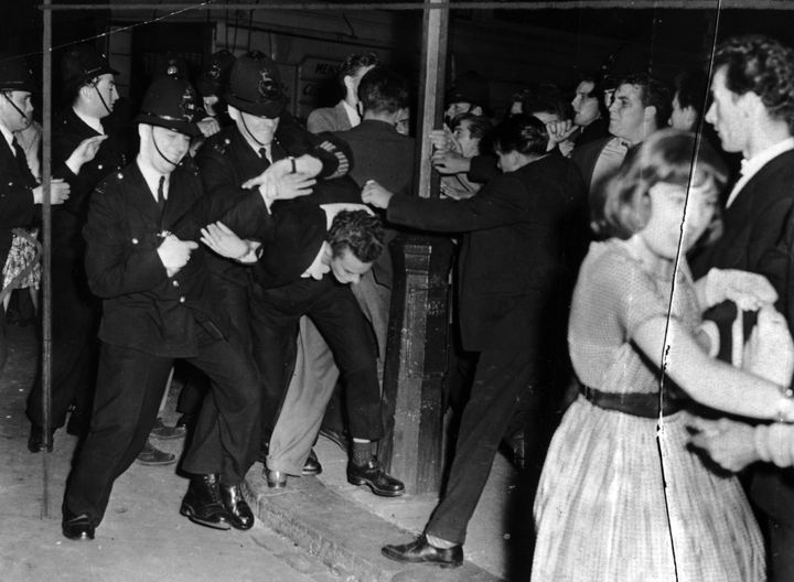 Youths clash with police during the Notting Hill race riots in 1958