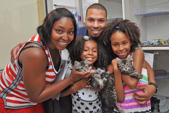 <em>Family from the New York area with newly adopted pets during “Clear the Shelters” 2015.</em>