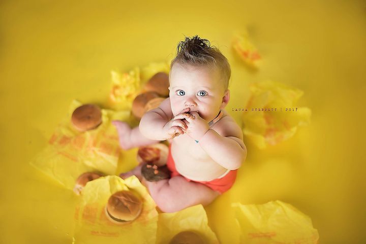 “It was a silly photo shoot, and we used cheeseburgers as props kind of like a cake is a prop in a cake smash photo shoot,” the mom said. 