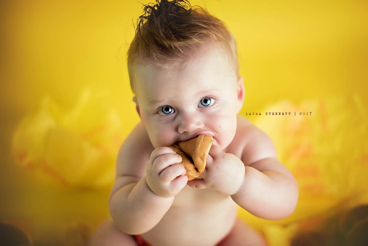 "He gummed some of the patty and the buns and squished them in his fingers, but he was all about eating the pickles!” said the photographer.