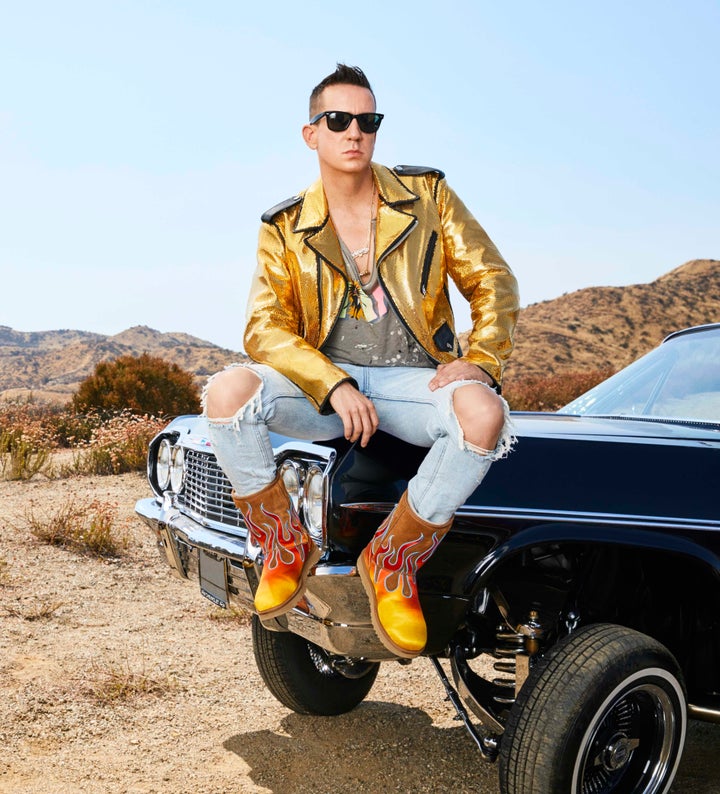 Jeremy Scott models a pair of boots from his collaboration with Ugg.