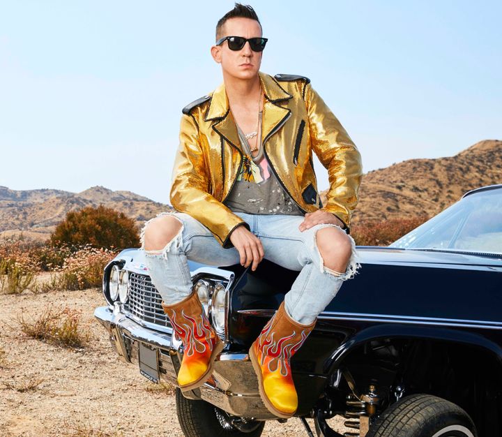 Jeremy Scott models a pair of boots from his collaboration with Ugg.