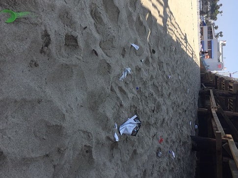 Plastic and rubbish buried in the sand