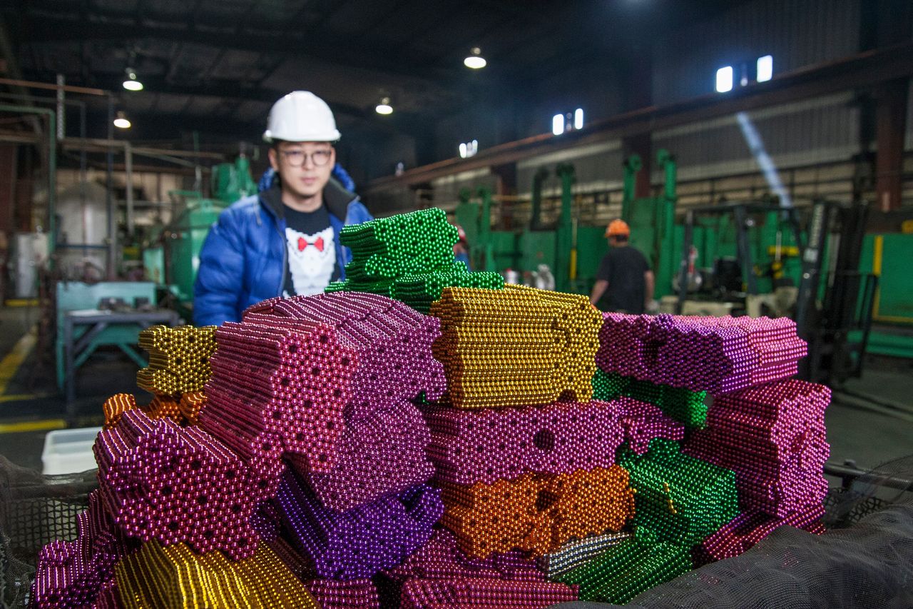 Zen Magnets founder Shihan Qu prepares high-powered magnet balls for destruction at the Metal Treating & Research Co. in Denver on April 26. A federal judge ordered Qu to eliminate the magnets as part of a long-running battle over the magnets' safety. 