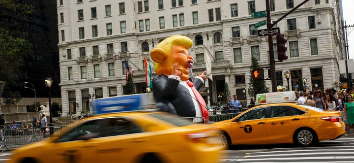 Trumpy the Rat stands at the corner of Fifth Avenue and 59th Street, a few blocks from Trump Tower.