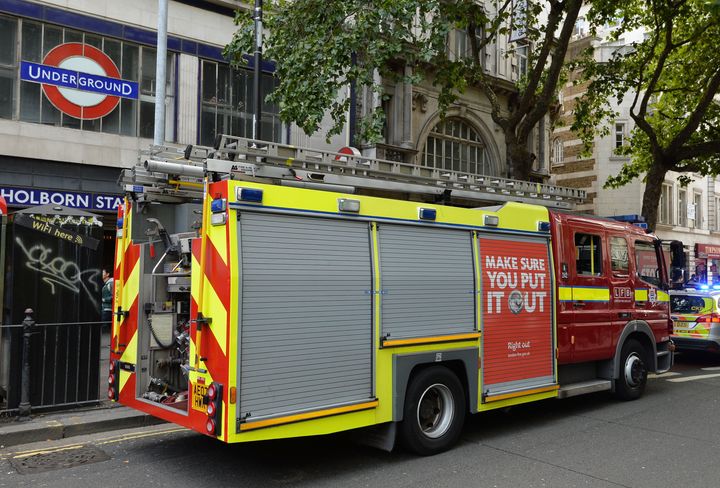 A fire engine outside a closed Holborn Underground station in London where engineers are checking a faulty train.