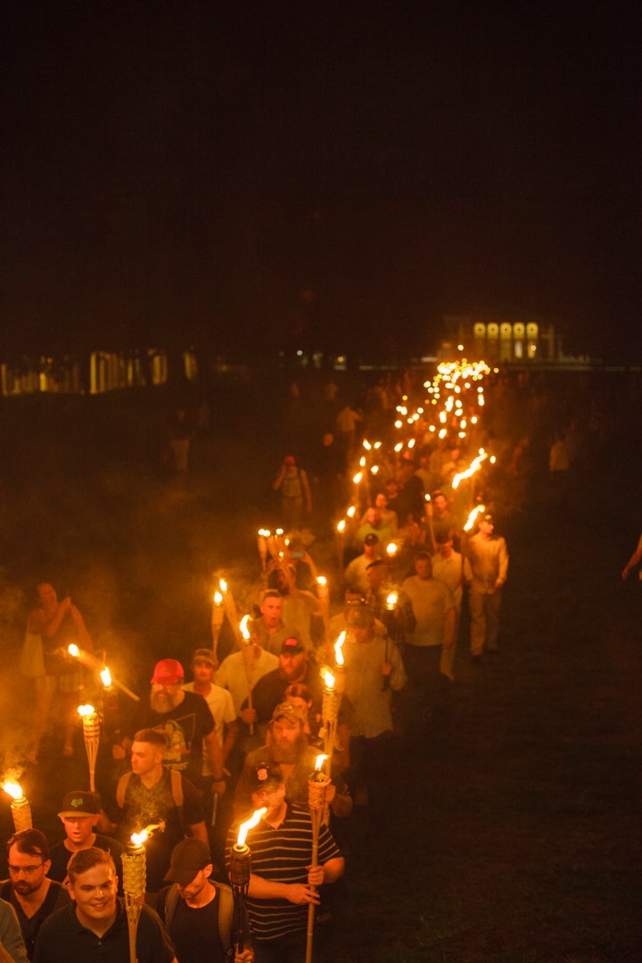 <strong>Neo-Nazis, white supremacists and white nationalists march with torches before the 'Unite the Right' rally </strong>