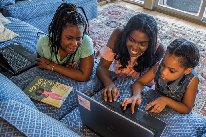 Sasha Ariel Alston (middle), a teen author, wrote a book titled Sasha Savvy Loves to Code to inspire girls to pursue STEM.