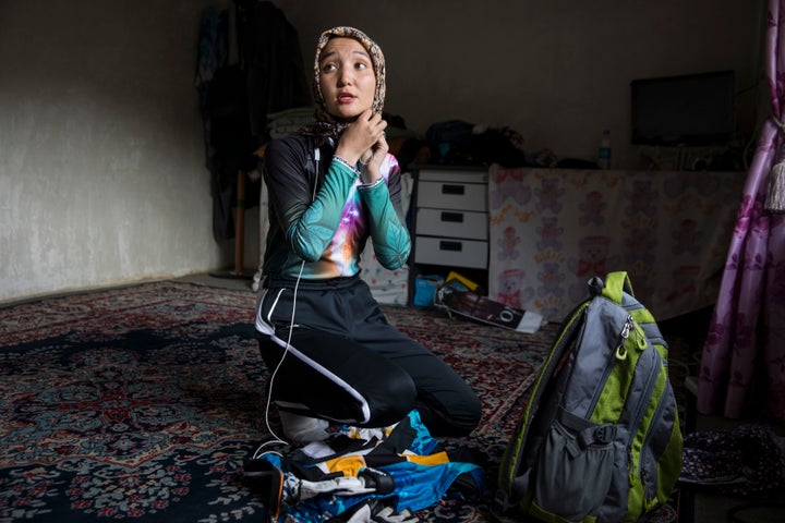 Photographer Paula Bronstein captured 23-year-old Zakia getting ready for a bike ride. It's frowned upon for women in Afghanistan to ride bicycles, but Zakia defies those stereotypes.