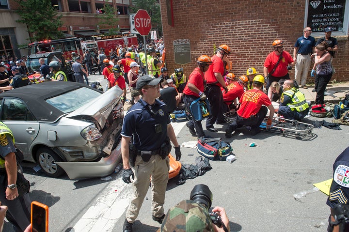 A woman receives first aid after a car ran into a crowd of people in Charlottesville, Virginia, on Aug. 12, 2017.