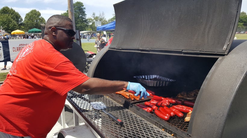 Ron Garrett of Samurai Motorcycle Club monitors the grill at the Eighth of August cookout.