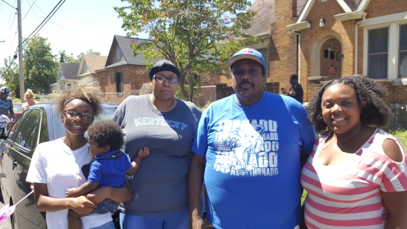 Joseph and Je’ na Patterson enjoy the Eighth of August parade with their daughters.