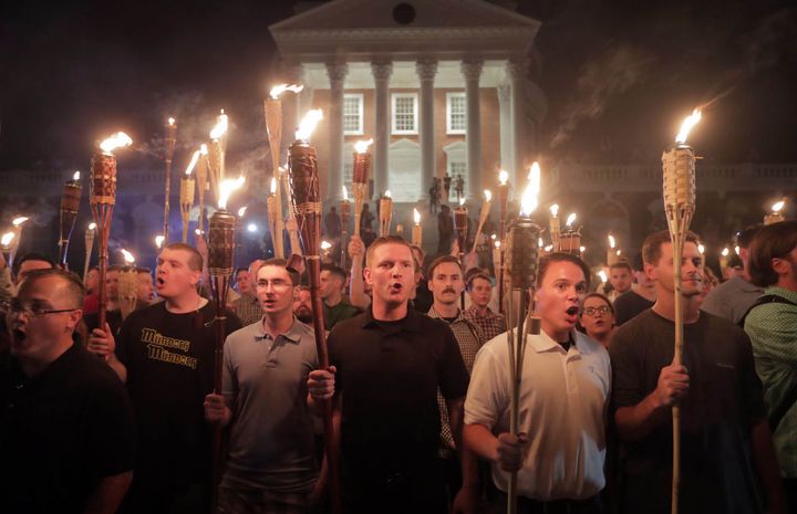 White supremacist protesters march at the University of Virginia in Charlottesville Friday.