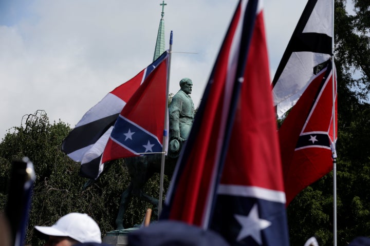 Members of white nationalist groups rally around a statue of Robert E. Lee in Charlottesville, Virginia, U.S., August 12, 201