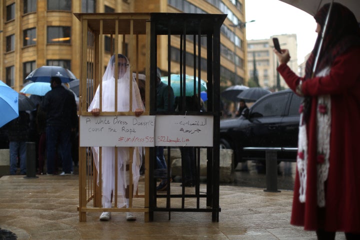 An activist from Abaad, a women's rights group in Lebanon, protests a law that shields rapists from prosecution on the condition that they marry their victim.